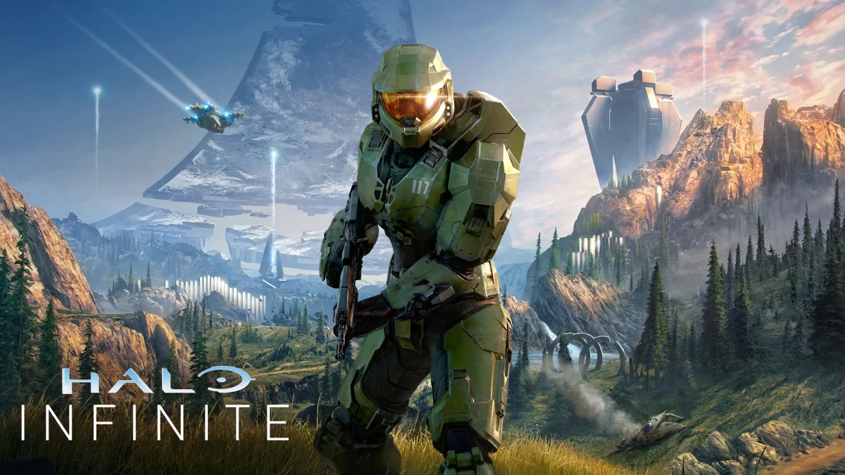 A futuristic soldier in green armour stands ready with a weapon in a mountainous, alien landscape dotted with spaceships and structures, offering inspiration for UI/UX design for videogames beneath the iconic Halo Infinite logo.